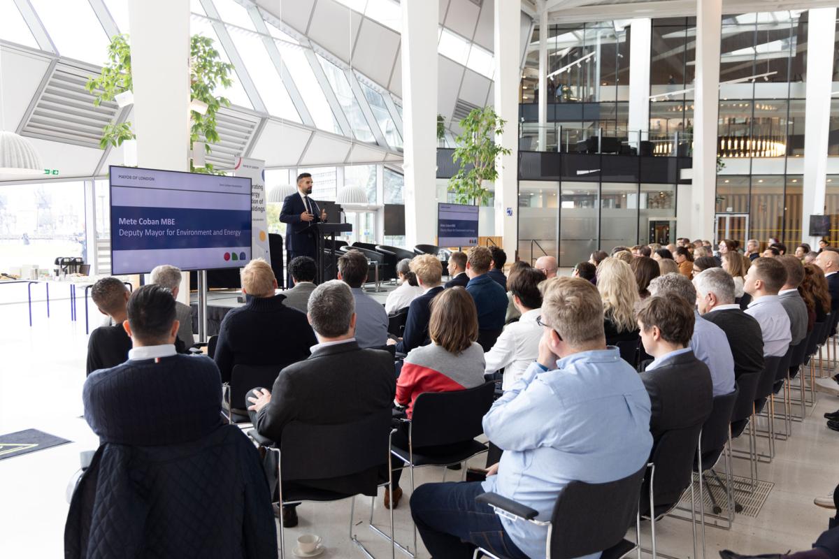 audience watching a speaker at an industry event